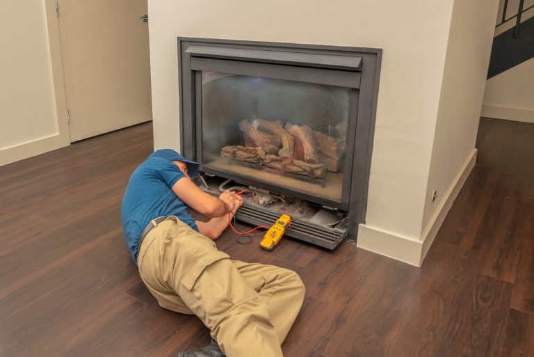 Technician performing fireplace diagnostics and inspection service